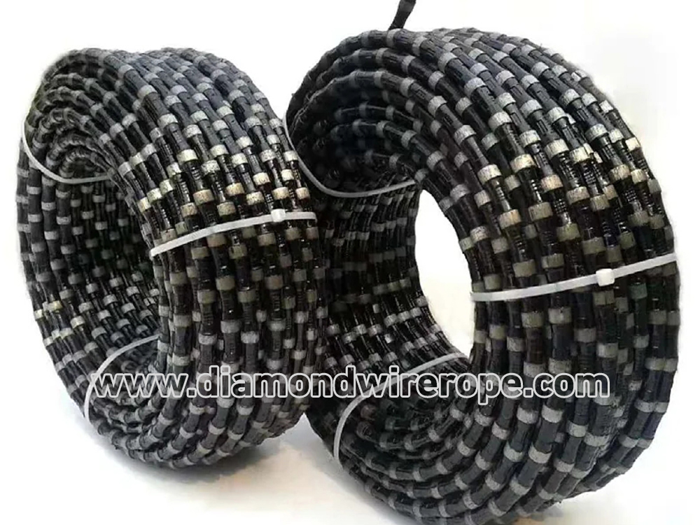 Spring diamond rope saw for marble quarrying